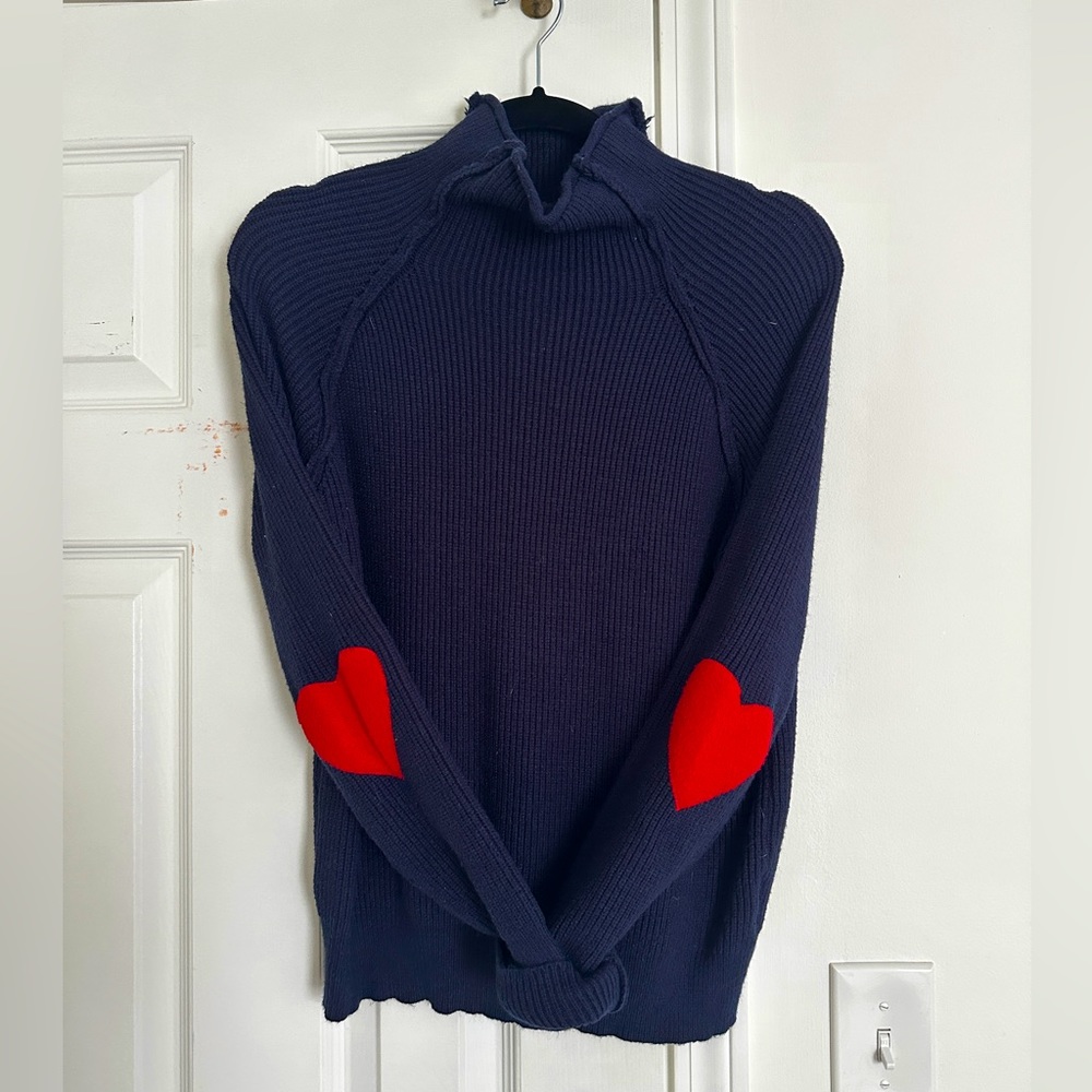 Adorable navy sweater with hearts on the elbows.